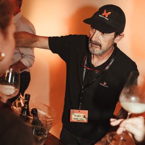 man pouring wine